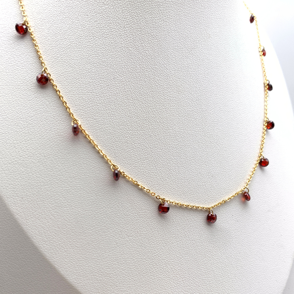 collana in acciaio gold con perline a ciondolo rosso rubino