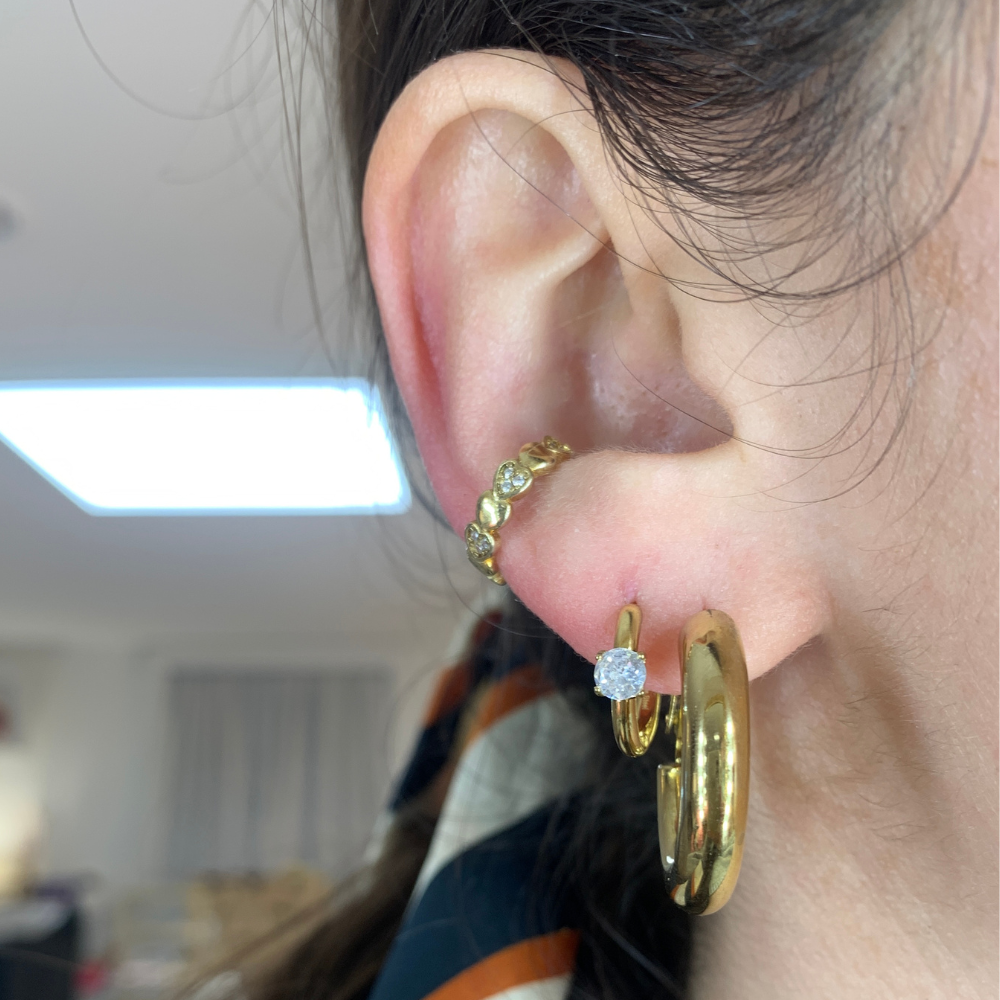 orecchini in acciaio gold piccoli con zircone bianco punto luce