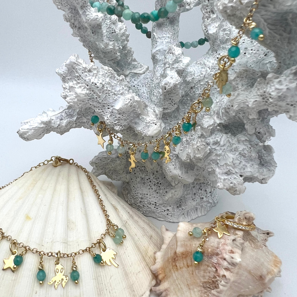 set in argento 925 placcato oro con hoop pendente con stellina e pietre dure azzurre e bracciale con pietre azzurre e ciondoli stella palma e polipo in argento gold