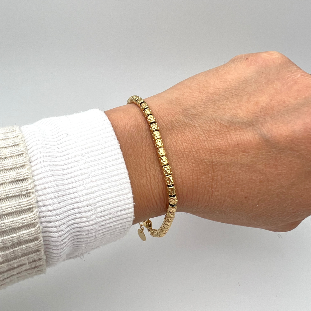 bracciale in acciaio con rondelle martellate