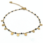 cavigliera in acciaio gold con medagliette pendenti e perline smaltate nere