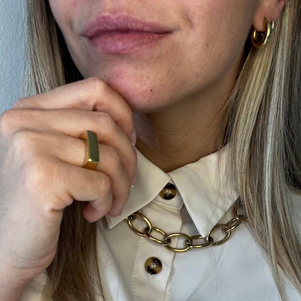 collana catena forzatina indossata in acciaio gold