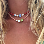 Collana Color Carne con Fiore e Occhio Greco in Acciaio Gold