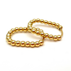 anello in acciaio gold con sfere ovalizzati