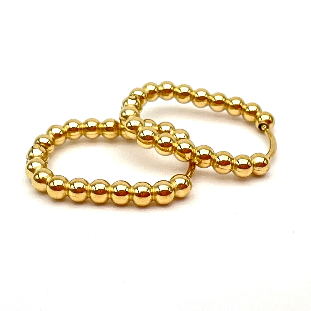 anello in acciaio gold con sfere ovalizzati