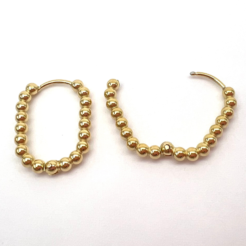 anello in acciaio gold ovalizzati con sfere