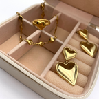 orecchini in acciaio inox gold con due cuori uno pendente