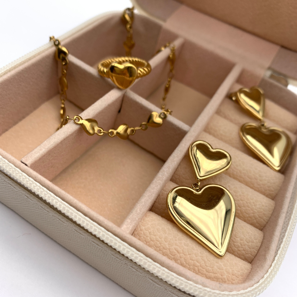 orecchini in acciaio inox gold con due cuori uno pendente